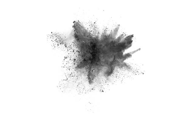 istock Black powder explosion. Closeup of black dust particles explode isolated on white background. 1143140006