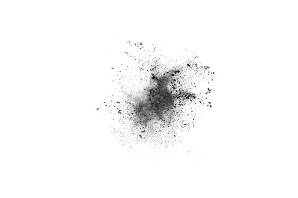 istock Black powder explosion. Closeup of black dust particles explode isolated on white background. 1143140008