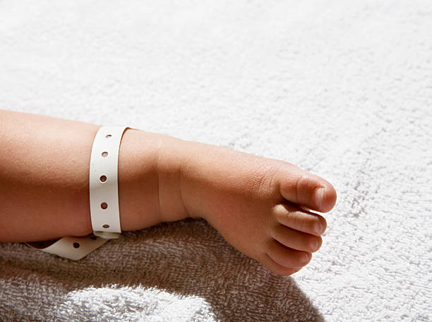Hospital tag baby foot  baby bracelet stock pictures, royalty-free photos & images
