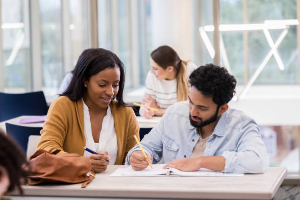 istock Male and female college students study together 1143140596