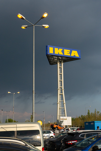 Bucharest, Romania - April 16, 2019: Vertical post with the IKEA sign on the Theodor Pallady street, Bucuresti, Romania. The Swedish furniture company opens its second store in Romania in 2019.