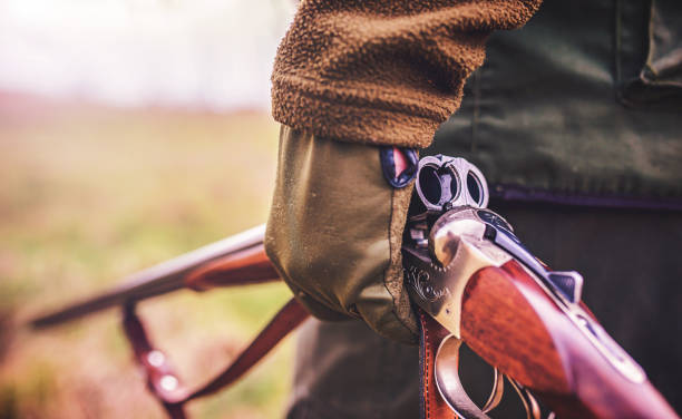 istock Hunter with a rifle in hunting 1143144277