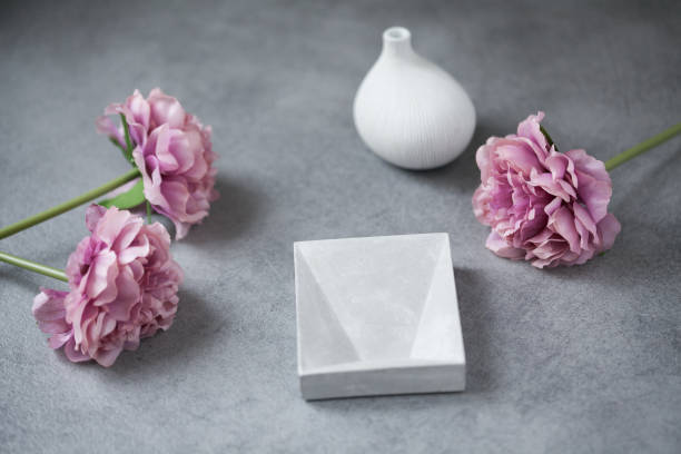 istock Mock up composition: concrete table, flowers, and vase 1143145753