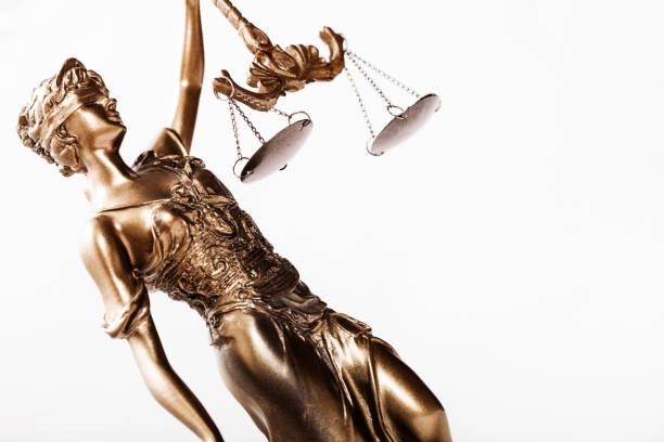 istock Justice blindfolded lady holding scales and sword statue 1143150504