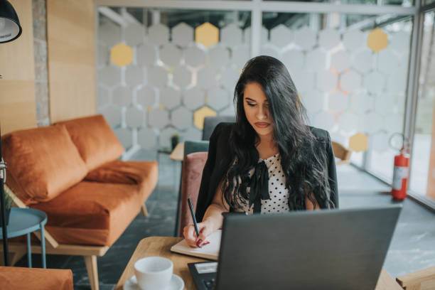istock Elegant female manager working in her office. 1143151333