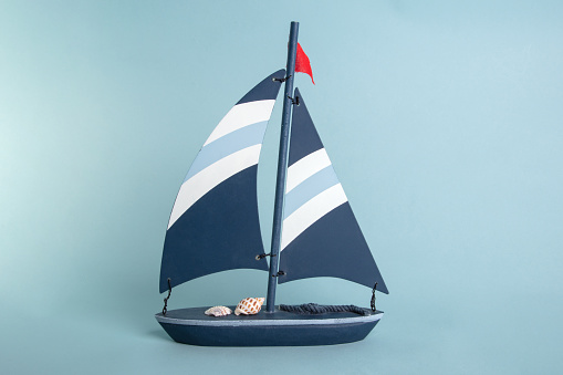 Wooden toy Boat on bright blue Background