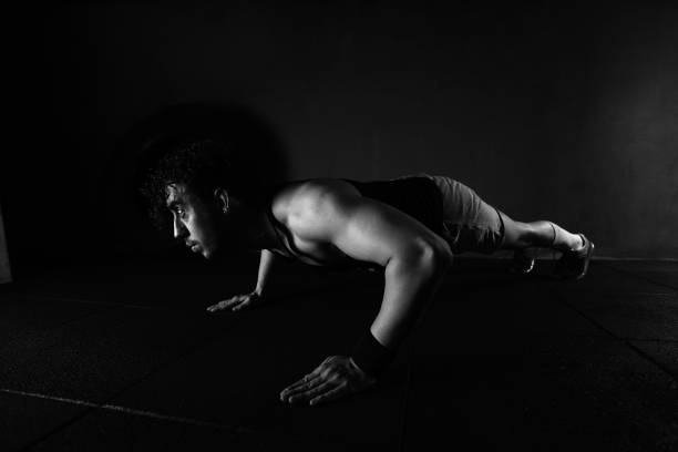 istock Cross training fitness. Young man exercising 1143162695