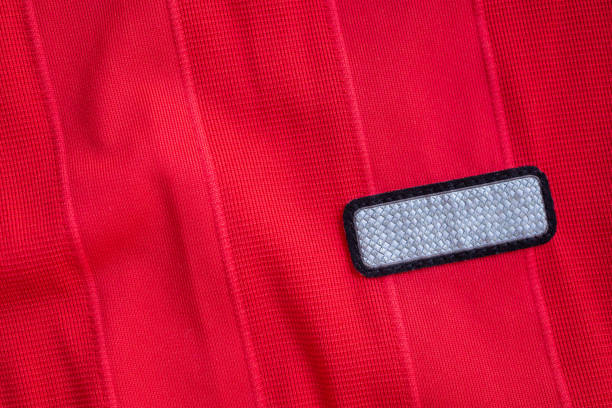 istock blank clothes tag label on red polyester sport jersey shirt texture background 1143163617
