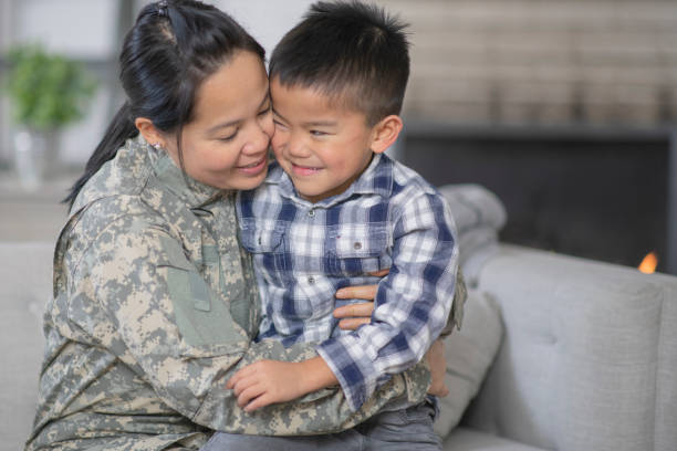 istock Military Mom Hugging Her Son 1143163725