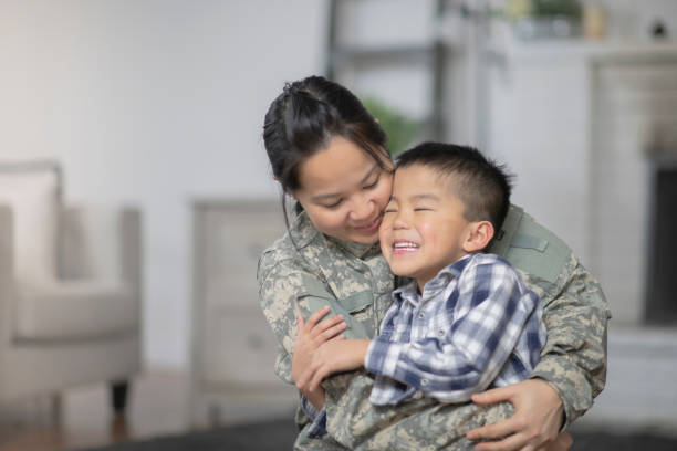 istock Military Mom Hugging Her Son 1143163726