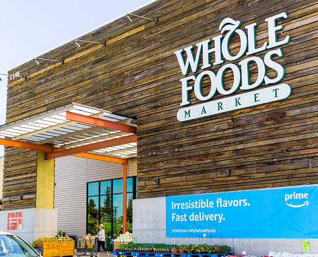 April 14, 2019 San Jose / CA / USA - Whole Foods store displaying an ad for Amazon Prime Membership