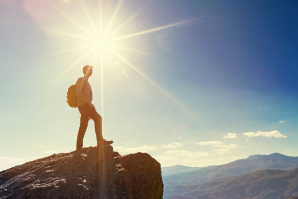 istock Man walking on the edge of a cliff 1143164753