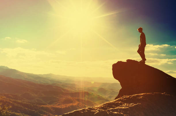 istock Man walking on the edge of a cliff 1143165313