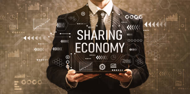 istock Sharing economy with businessman holding a tablet computer 1143165351
