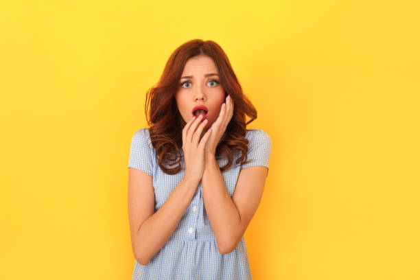 istock Young woman studio isolated on yellow empathy 1143165657
