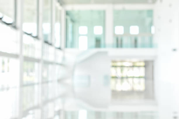 istock Business building blur background office lobby reception hall interior or empty indoor foyer room with blurry light from glass wall window 1143166981