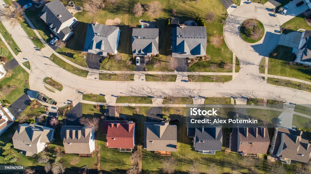 Top view directly above drone aerial view of the street in the residential neighborhood Libertyville, Vernon Hills, Chicago, Illinois. The residential neighborhood in Chicago, Illinois, USA, at the spring early morning Illinois Stock Photo