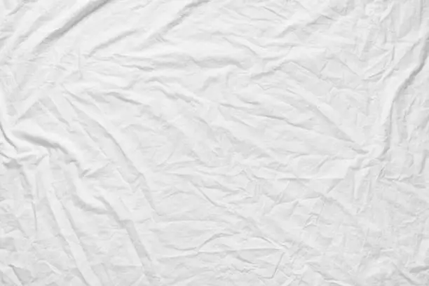 Photo of White fabic texture wrinkled texture ,Soft focus white fabic crumpled from bedding sheet use us background