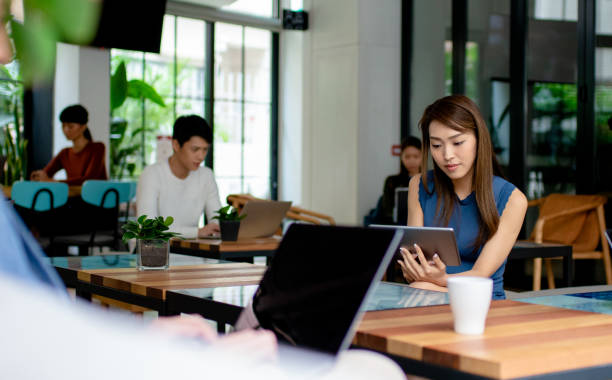 istock Group of people working in a modern co-working office 1143176834