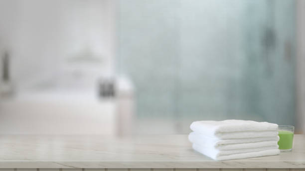 istock White towels on wood counter in modern bathroom 1143177612
