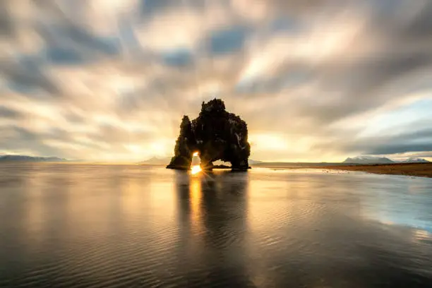 Photo of Beautiful amazing landscape view of Hvitserkur unique basalt rock in Iceland. The majestic Hvitserkur is a 15 meter high monolith standing offshore of Vatnsnes peninsula in North-West Iceland. It's famous travel destination of Iceland.