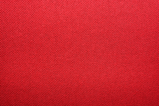 The texture of the knitted red fabric for the background
