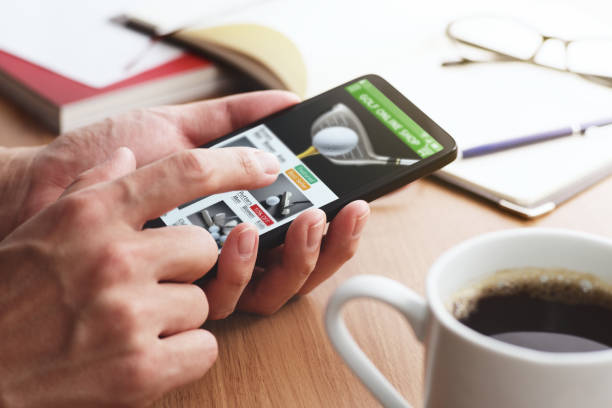 istock Online shopping concept. Golf shop website on smartphone display. 1143180418