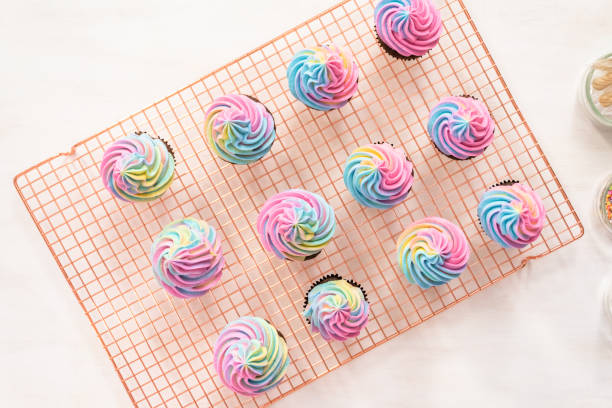 istock Decorating chocolate unicorn cupcakes with colorful buttercream icing 1143184103