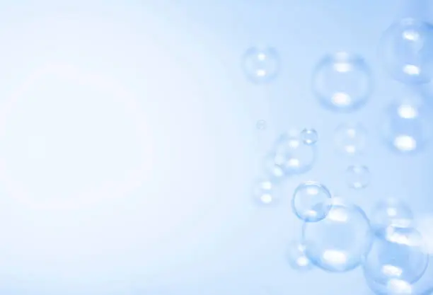 Photo of Blue soap bubbles background