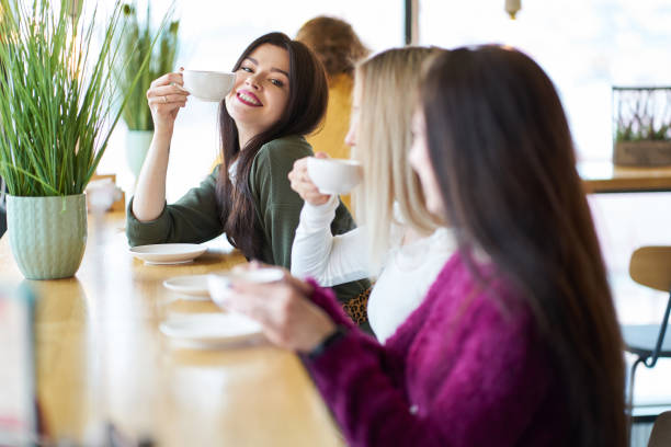 istock Girlfriends have a talk in cafe during teatime 1143186252