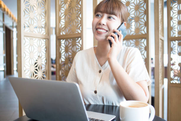 istock Young Beautiful Asian Women Using Laptop and Phone 1143186701