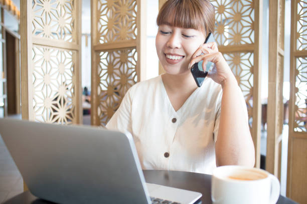 istock Young Beautiful Asian Women Using Laptop and Phone 1143187416