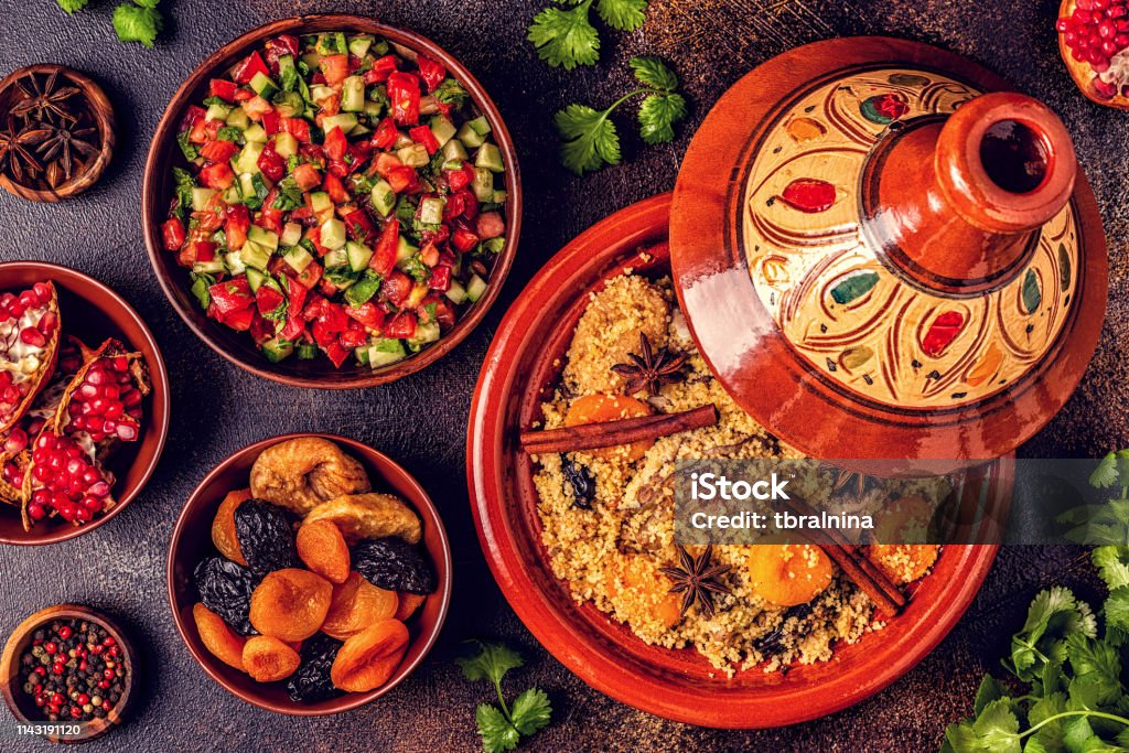Traditional moroccan tajine of chicken with dried fruits and spices Traditional moroccan tajine of chicken with dried fruits and spices, top view. Food Stock Photo