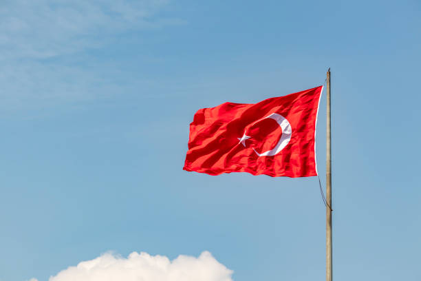 istock red turkish flag with moon and star on flagpole 1143192281