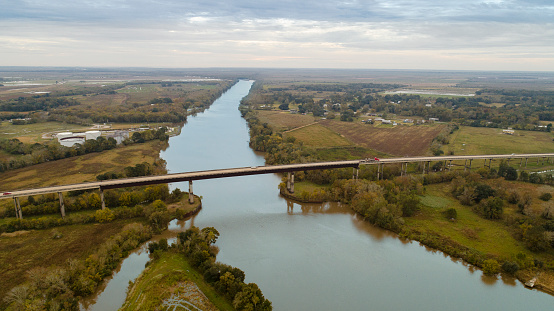 The highway and bridge across the Vermillion River nearby Abbeville, Louisiana, in autumn.