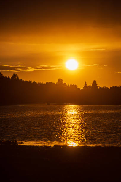 istock dark red sunset over sea in evening 1143195823