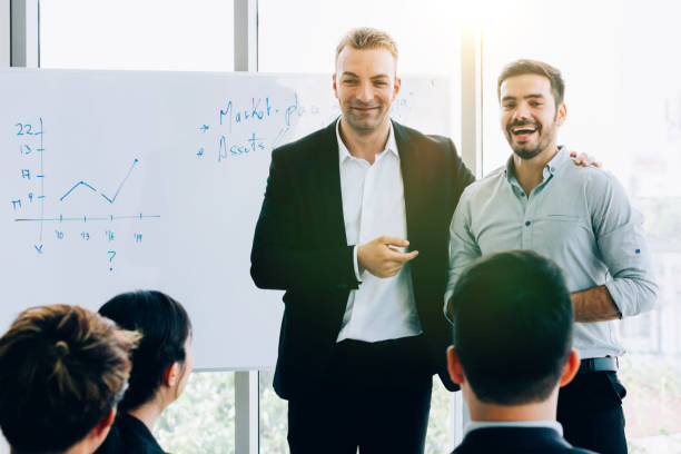 istock Contemporary businessmen making presentation for colleagues 1143195868