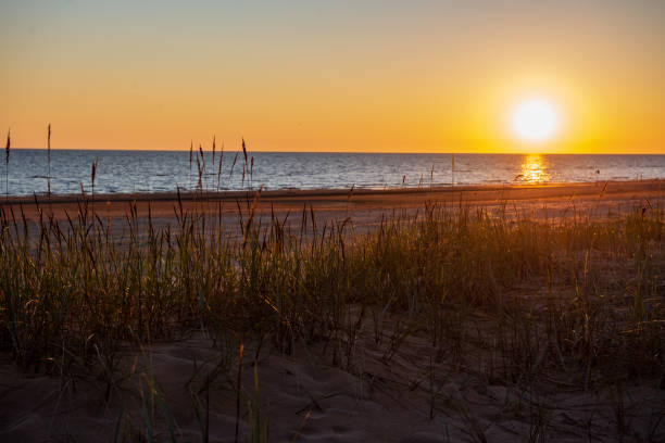 istock dark red sunset over sea in evening 1143195869