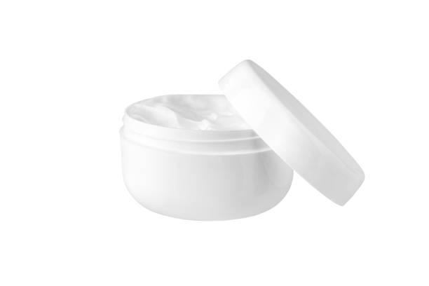 istock Open white cream jar on white background isolated close up, moisturizing hand, face or body cream plastic round bottle with open lid mock up, cosmetic package product design template, copy space 1143196449
