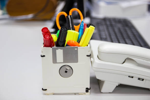 istock recycle floppy disk, Creative objects used for Store supplies such as pen pencils Scissors in a box 1143198924