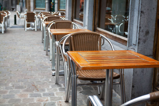 istock Chairs and tables outside of bistro 1143199235