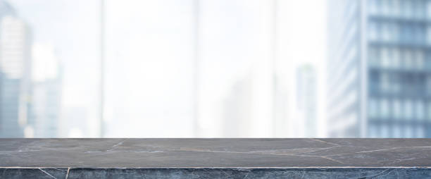 istock Empty black marble stone table top and blur glass window wall building banner mock up background - can used for display or montage your products. 1143202680