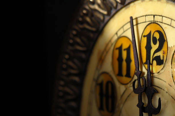 Almost twelve o'clock on the clock Face of an antique clock, about to strike 12 its almost time stock pictures, royalty-free photos & images