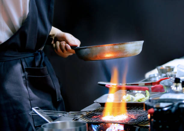 istock Chef preparing food, meal, in the kitchen, chef cooking, Chef decorating dish 1143205838