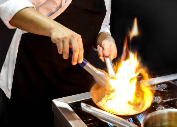 istock Chef preparing food, meal, in the kitchen, chef cooking, Chef decorating dish 1143205847