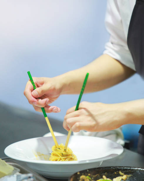istock Chef cooking food in the kitchen, Chef preparing food 1143205876