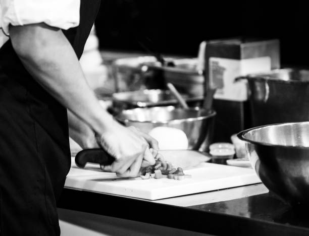 istock Chef cooking food in the kitchen, Chef preparing food 1143205880
