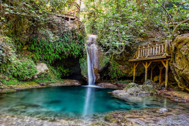 Turgut Falls a small scale waterfall white silky water falling into aquarium blue still pond Orhaniye Mahallesi Marmaris Mugla Turkey Turgut Falls a small scale waterfall white silky water falling into aquarium blue still pond Orhaniye Mahallesi Marmaris Mugla Turkey marmaris stock pictures, royalty-free photos & images