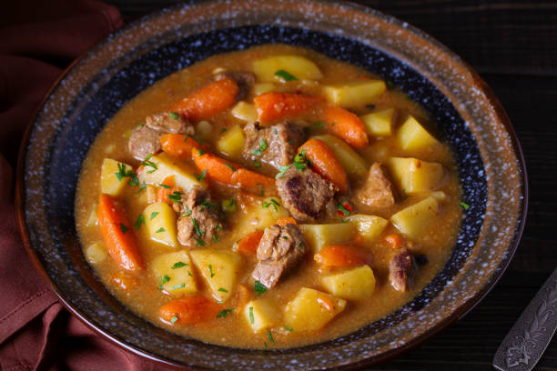 istock Homemade beef stew with vegetables in bowl on wooden table 1143206873