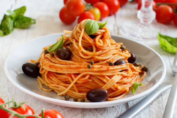 istock Spaghetti with tomato sauce olives and capers 1143207249